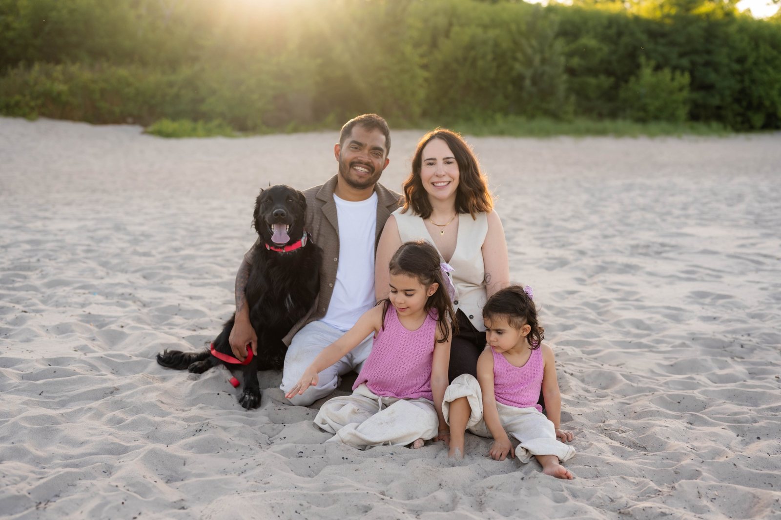 Aatish Jamal with his wife, daughters and family dog